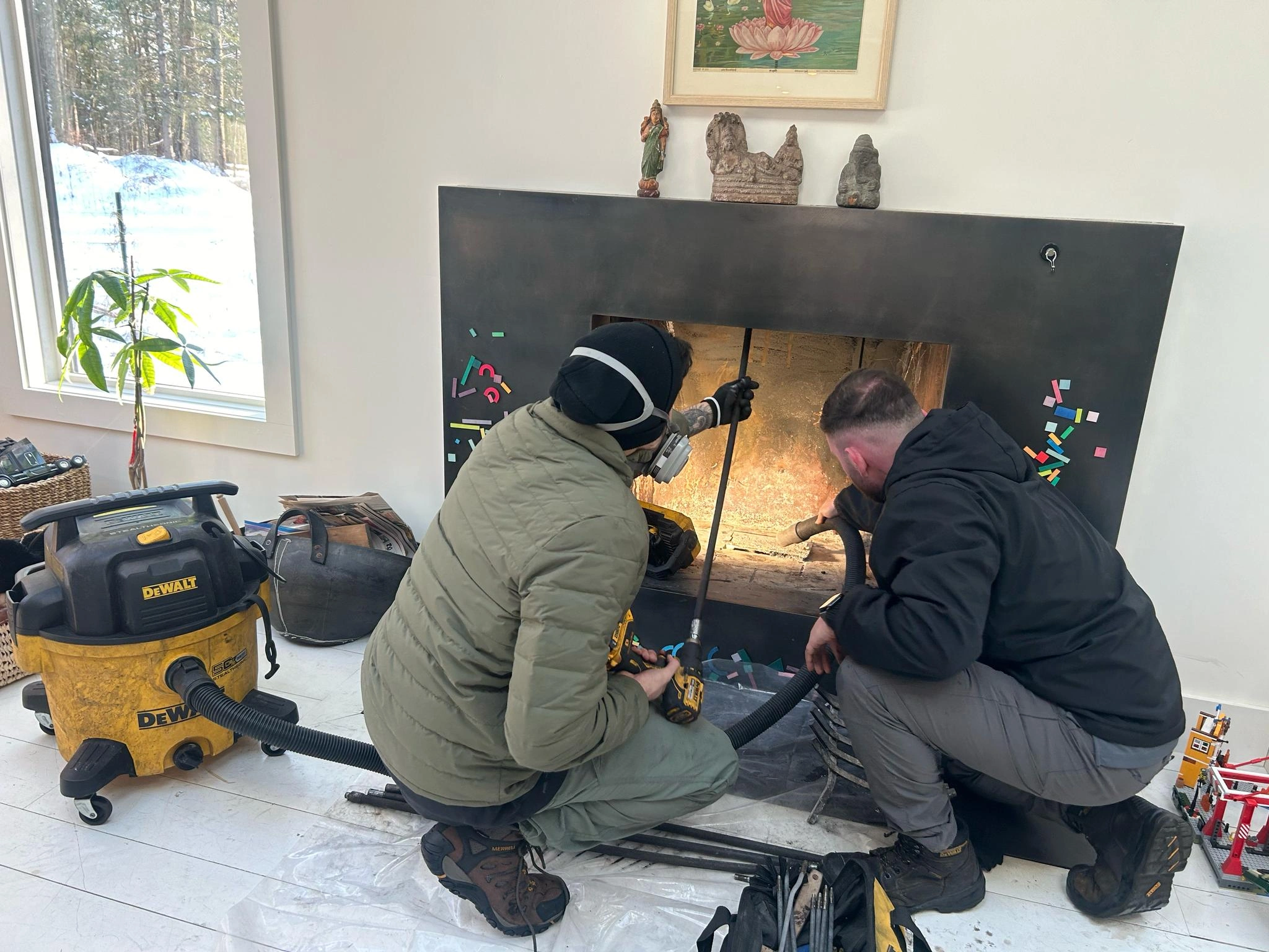 2 men cleaning the chimney